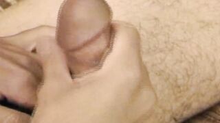 Hairy young guy tugs raging dick and cums all over the place