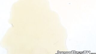 Oriental teen soaks her panties and the floor up with piss