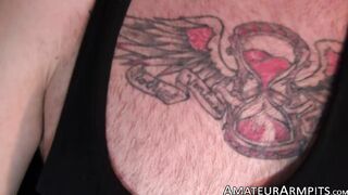 Horny inked stallion sniffs his armpits while masturbating