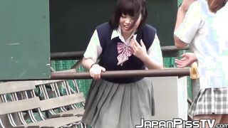 Naughty Japanese schoolgirls pissing in secret public place