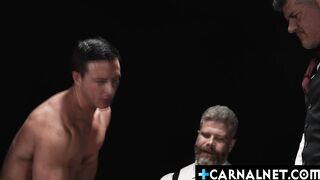 Milo Miles surrounded by a trio of men