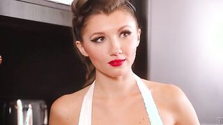 Bombshell 50s housewife Maya Woulfe puts on a record as she waits for her husband, Nathan Bronson, to come home.