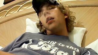 Blonde twink Casey Wood jerks off his dong while smoking