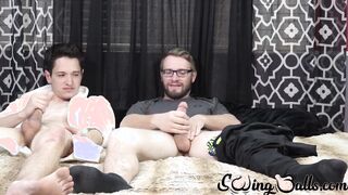 Two buddies with saggy balls masturbate together and cum