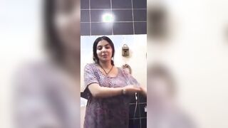Cute face girl on video call in washroom