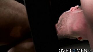 Mike Maverick fucks with Hans Berlin in a glory hole room