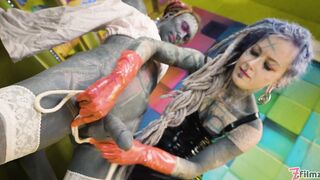 Two latex dominatrix sissy femdom anal fisting