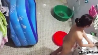 Asian stepdaughter spied in the bathhouse