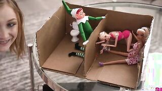 Andi Rose has enlisted Scarlet Skies to help her set up some Christmas elf pranks for her stepbrother, Robby Echo.