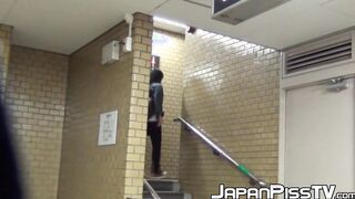 Pissing Japanese babe enjoying her time in public toilette