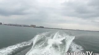 Voluptuous Japanese babe shows her tits and pussy on boat