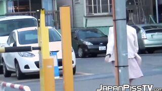 Classy Japanese redhead finds a secret place to pee