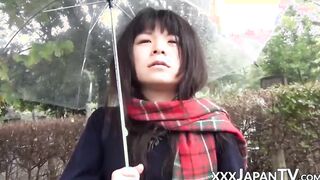 Cute Japanese chick has vibrator pleasing her in the rain