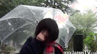 Cute Japanese chick has vibrator pleasing her in the rain