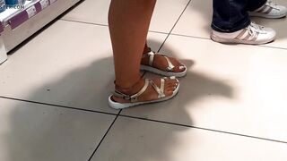 Her Hottie legs toes feet into sandals