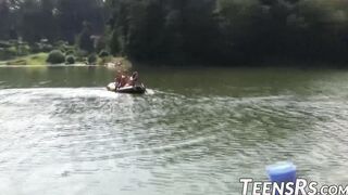 Group of naughty teens is having fun while swimming outdoor