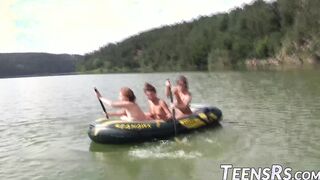 Group of naughty teens is having fun while swimming outdoor