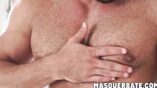 Muscular gay hunk playing with his big curved cock