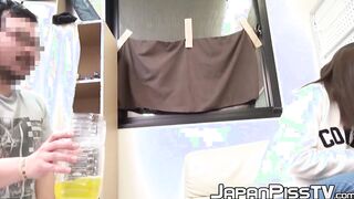 Japanese cutie removes her pants to fill the bottle with piss