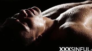 Erotic couple covered in water makes love in the dark