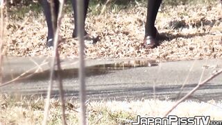 Kinky schoolgirls from Japan hold each other and pee outside