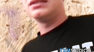 Blond twink fed with two dicks out in the open