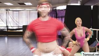 Busty TS fucks gym buddy and rides coachs cock