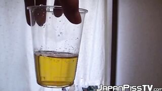 Adorable Japanese chick sits on the toilet and pees in a cup