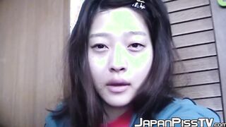 Adorable Japanese chick sits on the toilet and pees in a cup