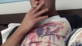 Tempting twink played with his cock and blowing smoke