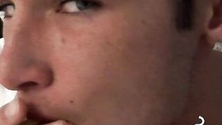 Tempting twink played with his cock and blowing smoke