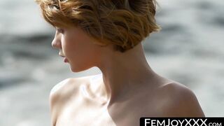 A sensual hipmoving redhead strips in front of others
