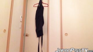 Naughty Japanese teen pees in a cup while putting makeup on