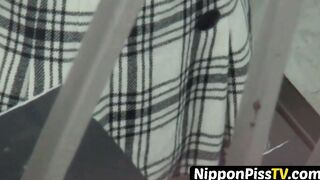 Japanese woman shot while peeing with stowed away cam
