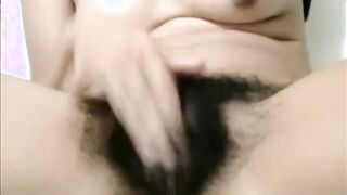 Arab mom Zina rubs extreme hairy cunt