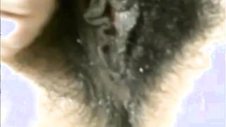 Arab mom Zina rubs extreme hairy cunt