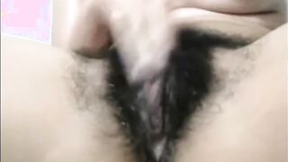 Arab mom Zina rubs extreme hairy cunt