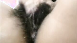 Arab mom Zina rubs extreme hairy cunt