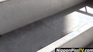 Perfect Oriental minx spilling pee on flight of stairs