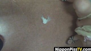 Japanese minx has shaggy pussy peeing in lobby