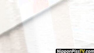 Japanese chick rubs herself outside before furtively peeing