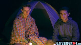 Lively stepbrother beat crude before a setting up camp fire