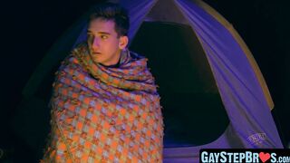 Lively stepbrother beat crude before a setting up camp fire