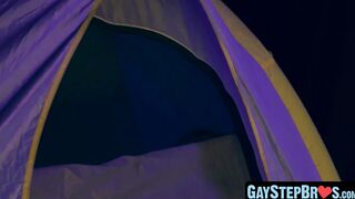 Lively stepbrother beat crude before a setting up camp fire