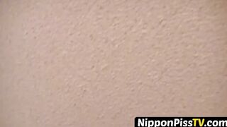 Delightful Japanese chick sits on the latrine and pees in a cup
