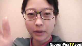 Delightful Japanese chick sits on the latrine and pees in a cup