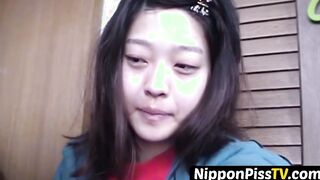 Delightful Japanese chick sits on the latrine and pees in a cup
