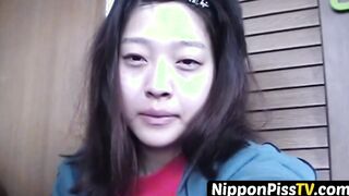 Delightful Japanese chick sits on the latrine and pees in a cup