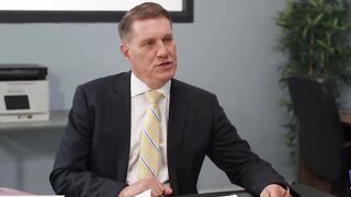 A man with a big dick fucks a red-haired boss in the pussy