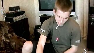 Hot dude stroking his huge dick and enjoys smoking butts